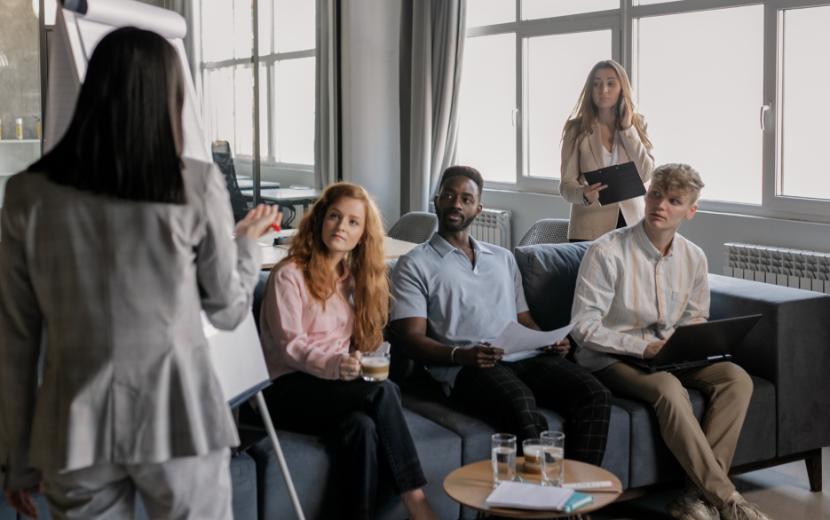 Woman presenting to a group of colleagues