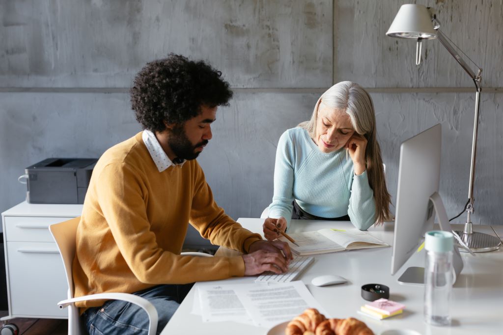 Two professionals having a feedback conversation